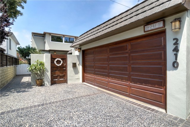 Two car garage plus room for two cars on the driveway