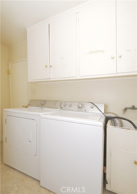 Large laundry room with access to rear yard.