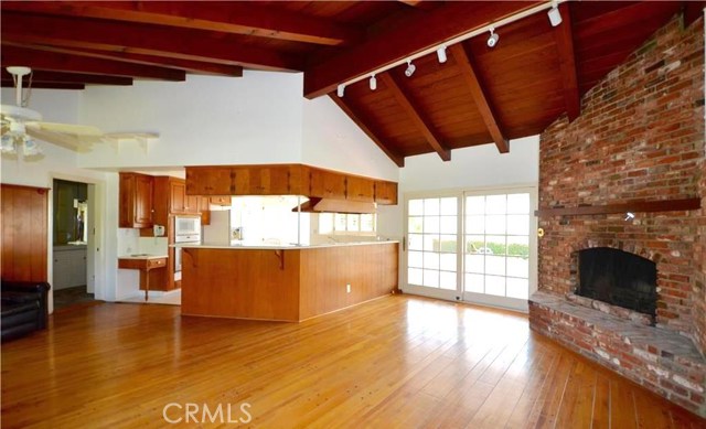 Family Room also has a feature wall fireplace and direct access out to an inviting spacious patio. Gorgeous cathedral beamed ceiling adds to the open plan of this ranch home.