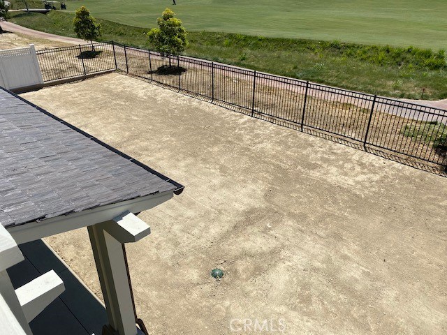 View from the 2nd story Master Bedroom looking down on the backyard. Lots of room for a pool and/or jacuzzi.