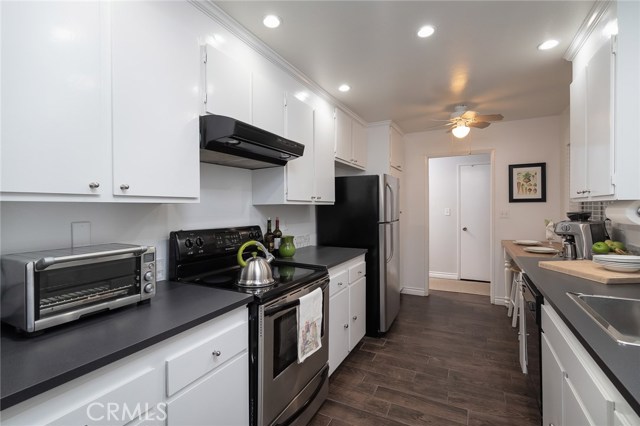 White Kitchen with Stainless Steel Appliances and Recessed Lights White Kitchen with Stainless Steel Appliances and Recessed Lights