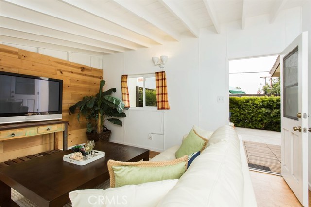 Detached bonus room with unique cork flooring and wood beam ceiling. Private entry from backyard.