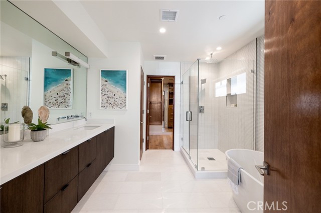 Spa like master bath with deluxe soaking tub, walk in shower, premium fixtures and custom cabinetry