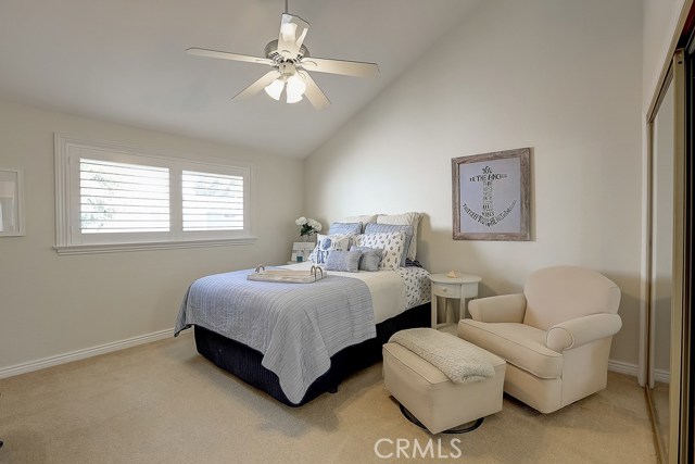 Pitched ceilings prevalent in this shot of the 4th bedroom facing the back yard.