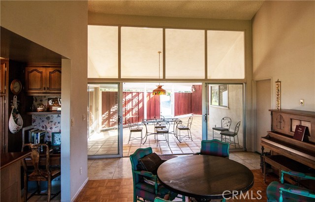 Separate family room connects kitchen and huge covered patio.