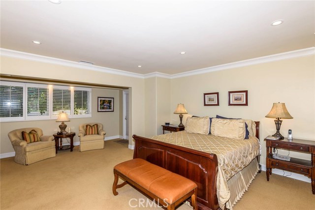 Spacious master suite with sitting area and entrance to rear backyard patio area.