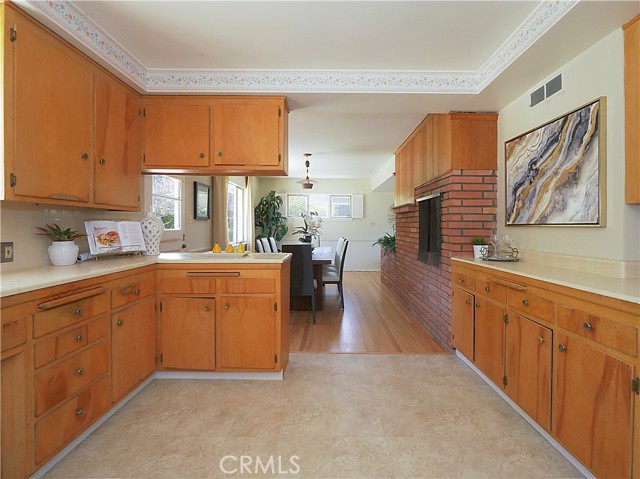 Kitchen opens to wonderful dining room.