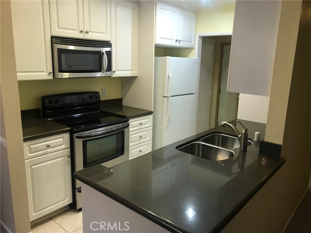 Remodeled Kitchen with Granit Counter-tops and Crown Molding