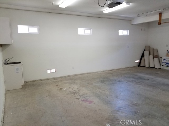 This is an extra large two car garage.  Might be able to fit 2 cars plus a motorcycle or golf cart?  Or plenty of room for storage.