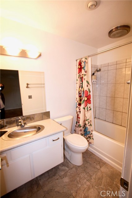 This bathroom is located directly off of the bedroom.