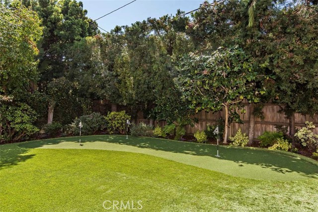 The large lot includes a putting green.