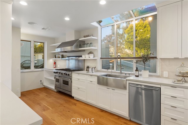 Kitchen with stainless steel appliances and double ovens.