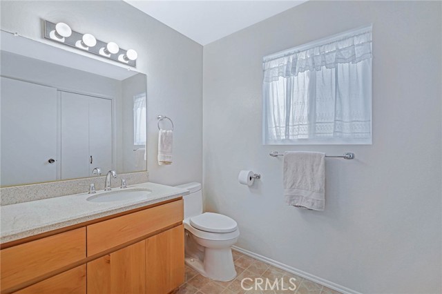 Downstairs Bath is on Kitchen/Dining level, Closets in downstairs Bath have Washer and Dryer in them with Storage Cabinets above.