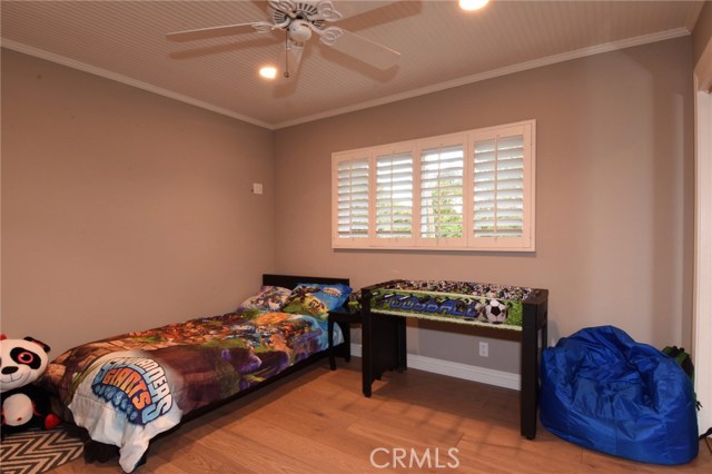 Bedroom #3.  All bedrooms have ocean peeks and custom wood ceilings + hardwood floors.