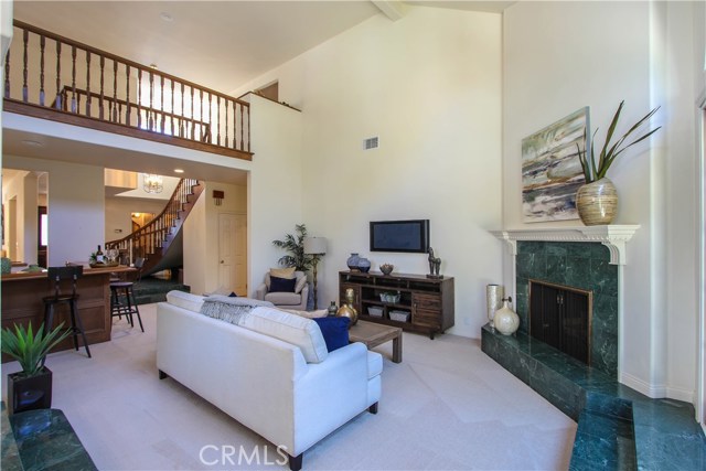 Spacious and bright Living Room with Marble surround Fireplace.