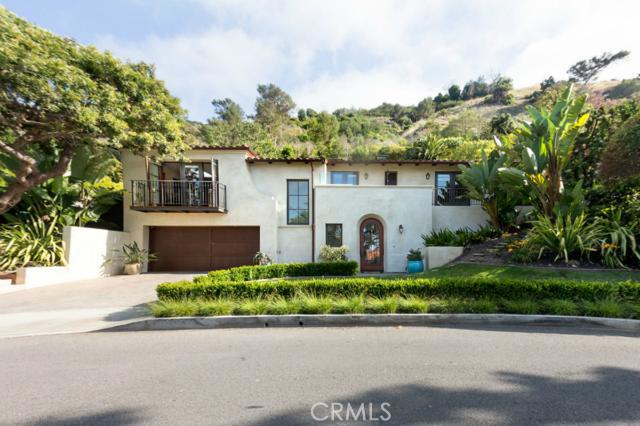Gorgeous Malaga Cove Spanish Home is located on a desirable street and backs up to open space