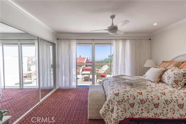 Two mirrored closets, ceiling fan, sunny views