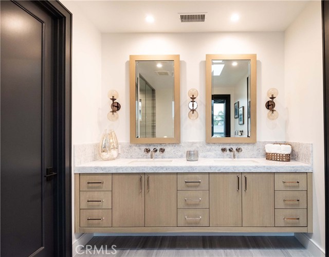 Master Bath Custom Double Sink with Granite Counter Tops and Custom Cabinets- Note the built in Outlets in the Medicine Cabinets and Drawers when you visit.