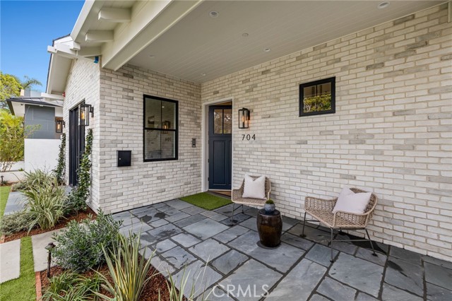 Front patios adjoin with lush landscaping