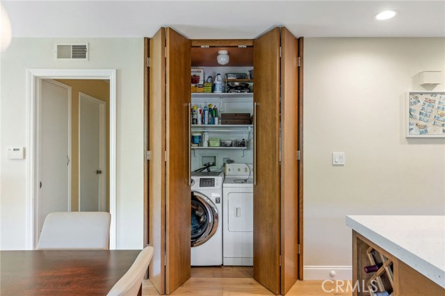 Dedicated laundry area and storage is in a convenient location.