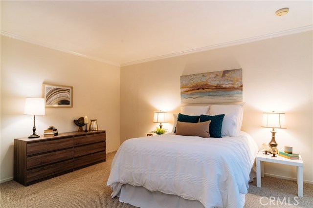 The spacious master bedroom offers a private retreat with dual closets and a master suite.