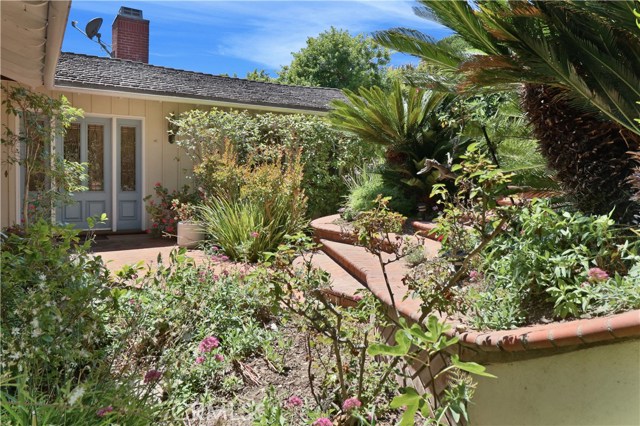 From the street at the end of the cul de sac, down the steps to the private entry