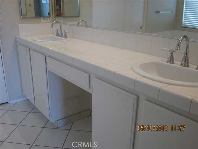 Lots of storage available in master bathroom.