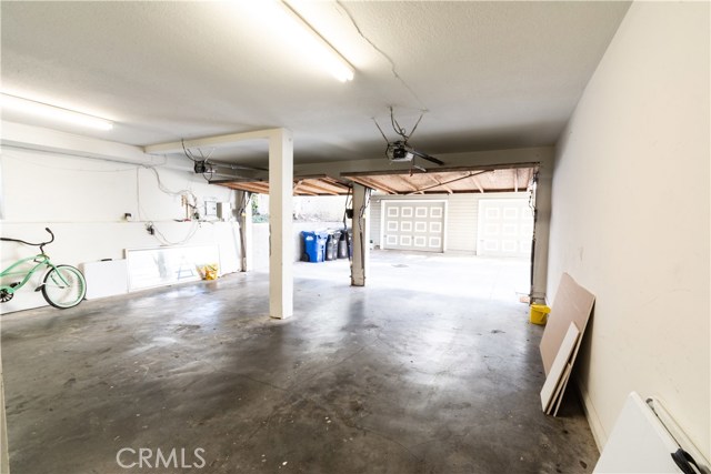 Large garage with laundry area and lots of storage!