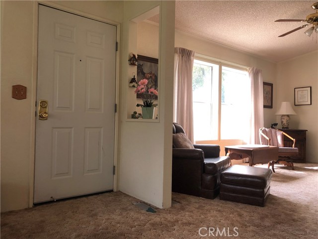 Front door and sitting area off kitchen.