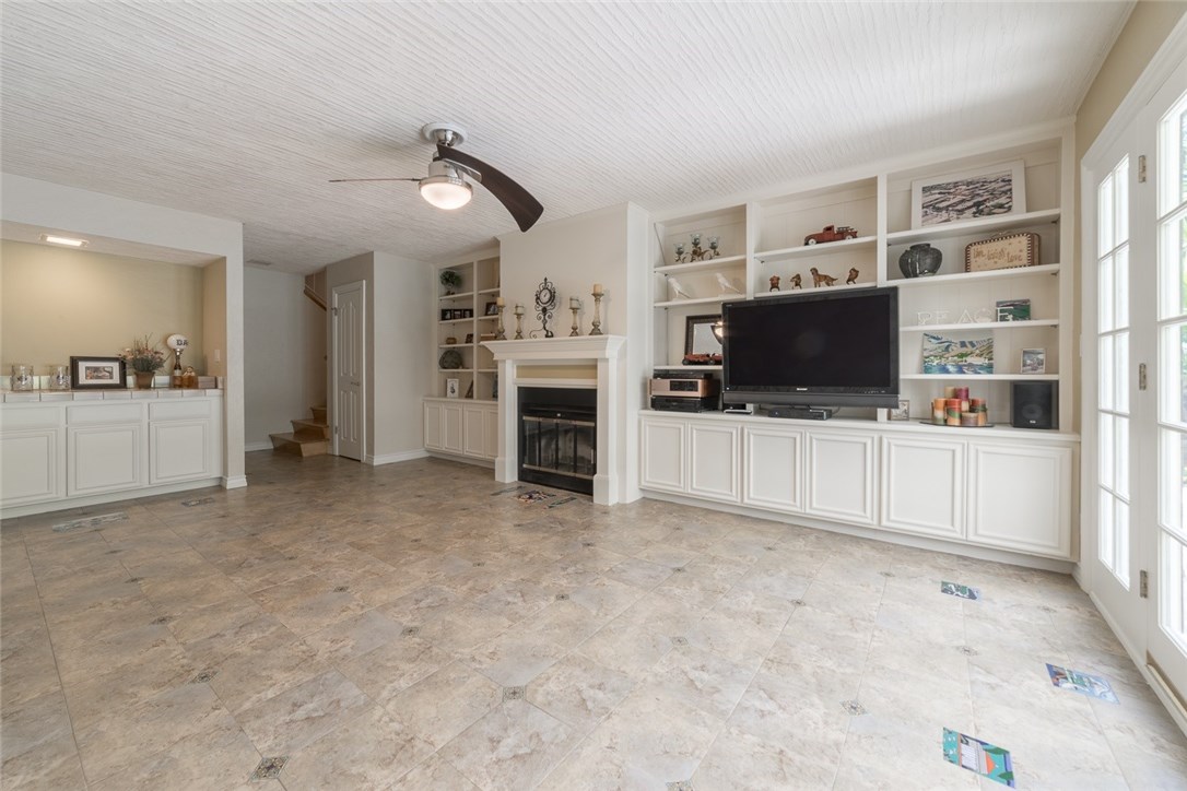 Happy times in your downstairs second family room with wet-bar included...