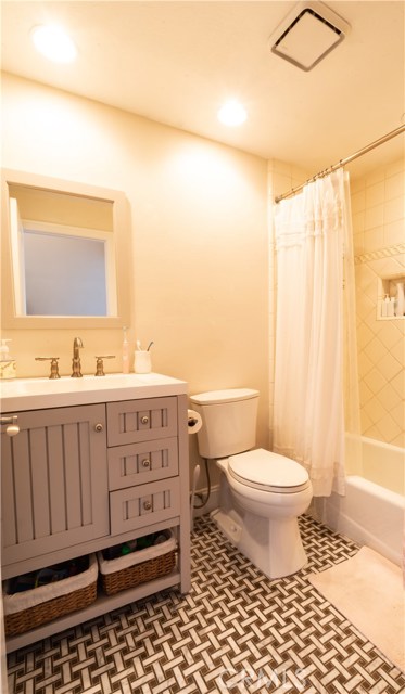 Full bathroom with tub and remodeled vanity