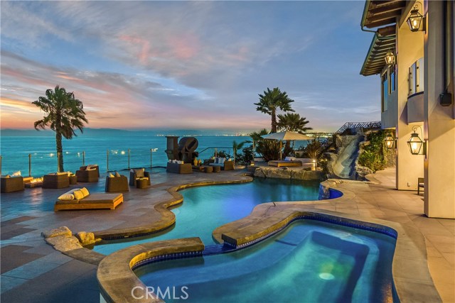 Like your own private resort...   Pool, spa, slide, fire pit, and panoramic ocean, coastline views.