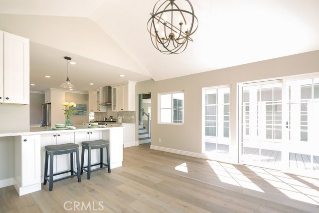 Spacious and light open floor plan for dinning area with sliders opening to deck