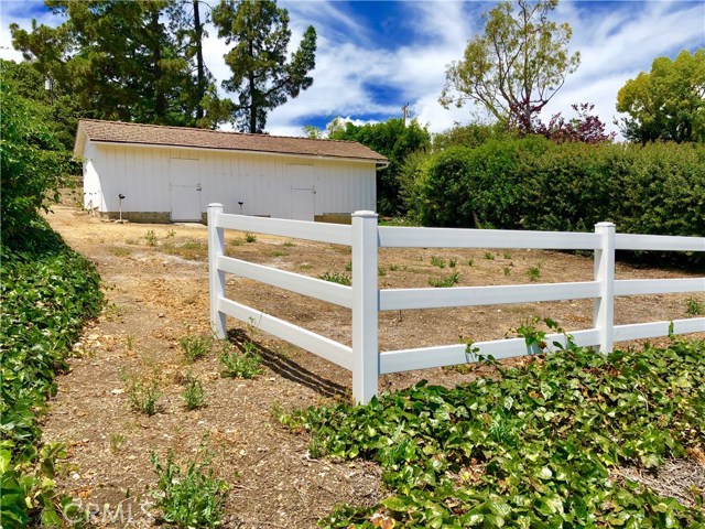 Old wooden fencing has been removed, but this is the perfect area to either divide into two turnouts or to allow the horses to be together.