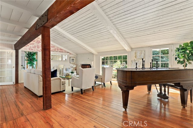What you see when you walk in....pitched ceiling, vast living room with open doors to the pool deck!