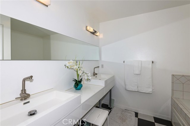 Remodeled master bath with double sink.