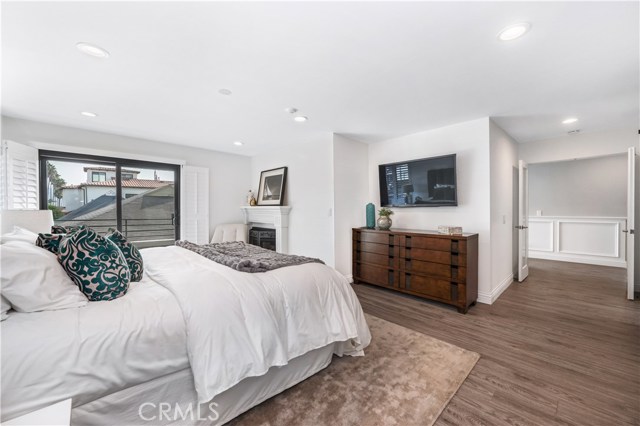 Primary bedroom, Double door entry, Hallway wainscoting, ship flap fireplace wall