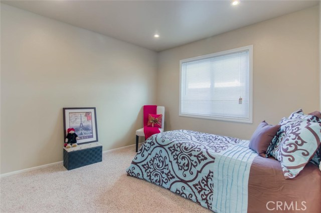 This is one of two bedrooms located on the main floor, complete with new carpet.