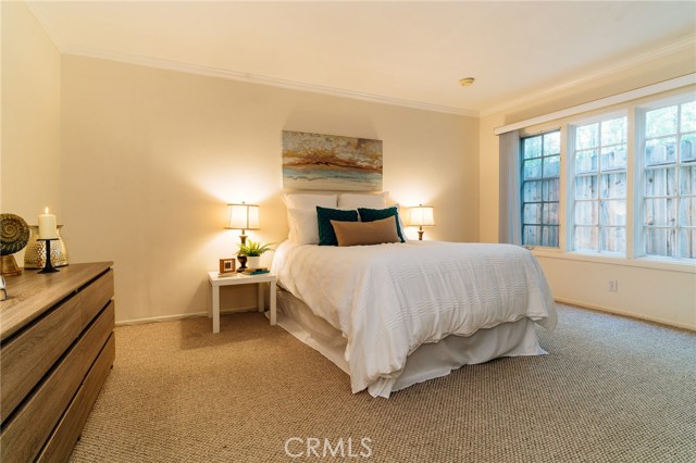 The spacious master bedroom offers a private retreat with dual closets and a master suite.