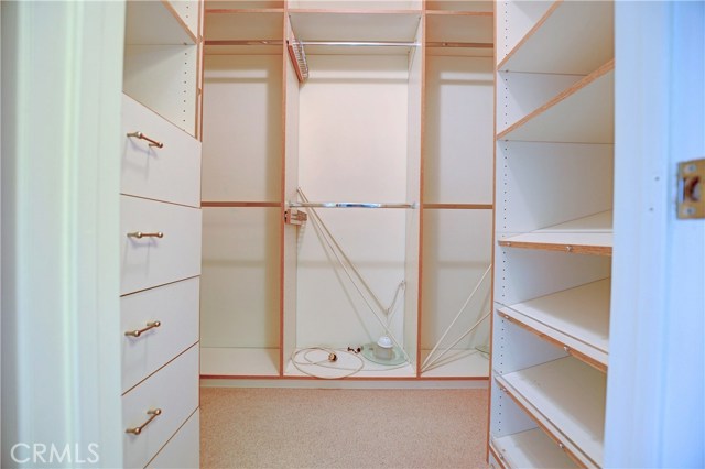 Walk in organized closet Walk in organized closet