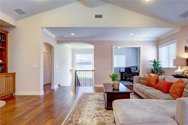 Huge open floor plan, tons of natural light, beautiful engineered hardwood floors, and adjacent den/office with French doors that could be converted to a 4th bedroom.