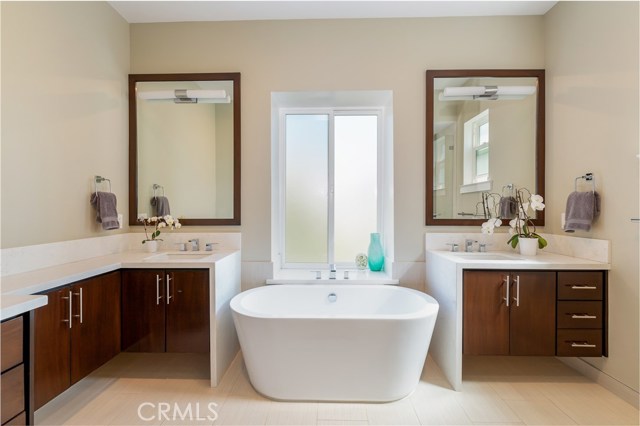 Master bath with soaking tub and his and hers vanities