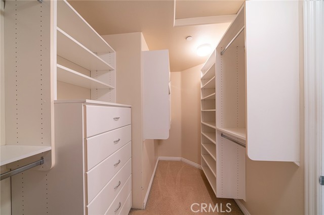 Primary bedroom walk in closet
