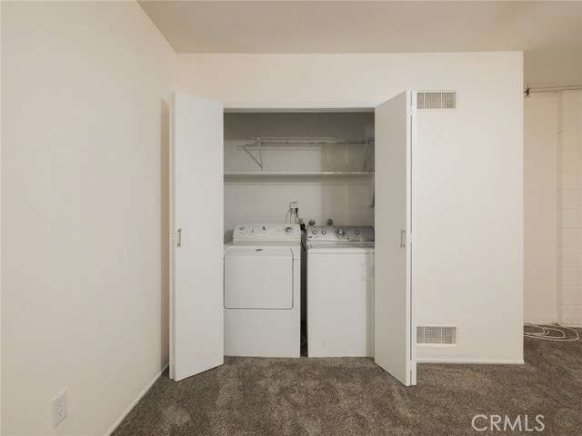 Laundry area in bonus room.