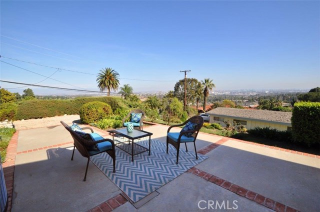 Patio in side yard overlooking view off of family room.