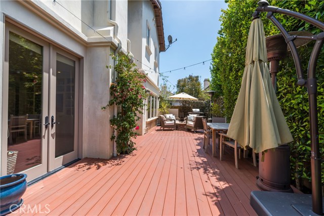 The rear yard is gorgeous!  Owner had the deck installed at living room height to make indoor/outdoor entertaining flow nicely.  It feels huge!  Built in fire pit is beyond.  You'll want to hang out here!