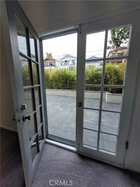 doors exiting off the bonus room to the side yard.