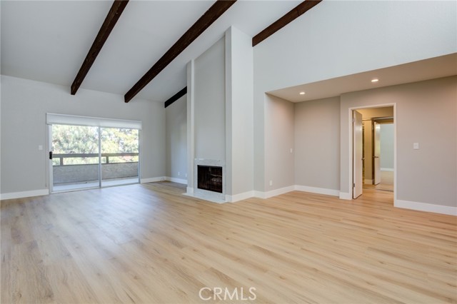 View of gas fireplace and sliding door to outdoor patio