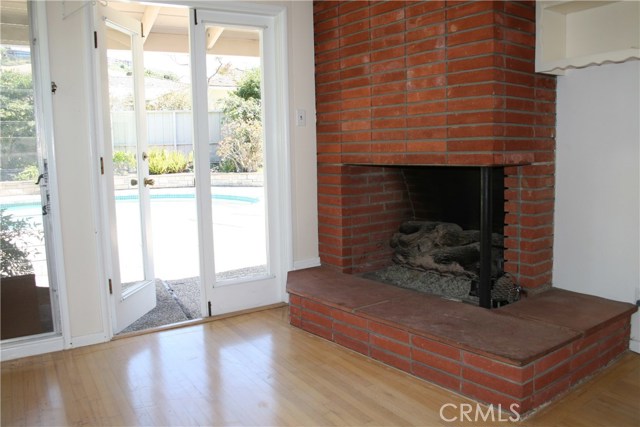 Den (adjacent to LR) has fireplace and french doors to backyard.