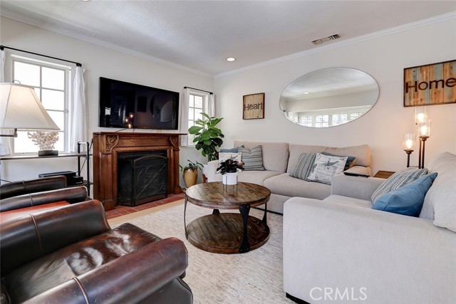 Sunny and bright throughout with hardwood floors plus a welcoming fireplace.